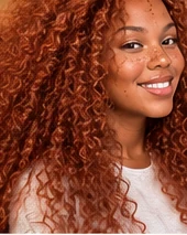 Crochet Braids femme couleur cuivre avec frange et boucles définies