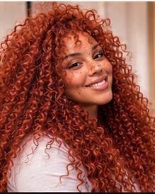 Crochet Braids femme roux cuivré, inspiration de cheveux bouclés longs et volumineux